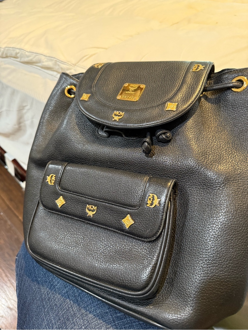 MCM Black Pebble Leather Drawstring Backpack with Gold Accents